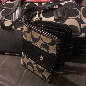 Coach purse with matching wallet is new condition